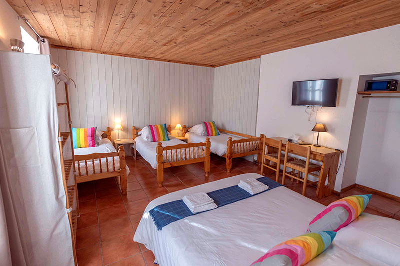 Chambre XL avec 3 lits simples et 1 lit double Grandes chambres familiales
